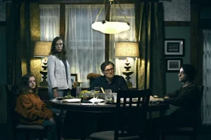 Ari Aster’s 2018 psychological horror film Hereditary uses sound as its most haunting weapon. The film’s chilling original score—composed by JUNO Award winner Colin Stetson—turns breath, wood, and vibration into pure dread, proving that in horror, the scariest moments are often the ones you hear, not see.
